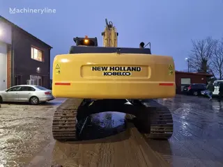 New Holland 349 Kobelco E385 — Foto 3