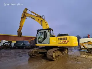 New Holland 349 Kobelco E385 — Foto 6