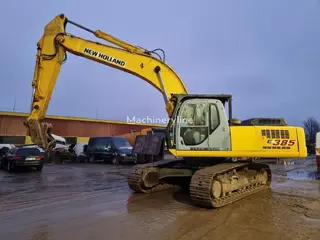 New Holland 349 Kobelco E385 — Foto 7