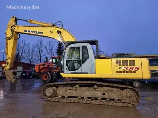 New Holland 349 Kobelco E385 — Foto 10