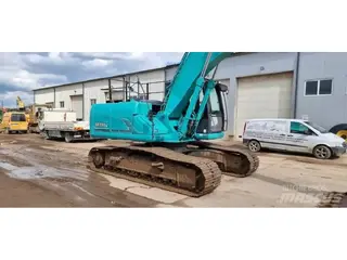Kobelco 1304 SK210LC-9 — Foto 2